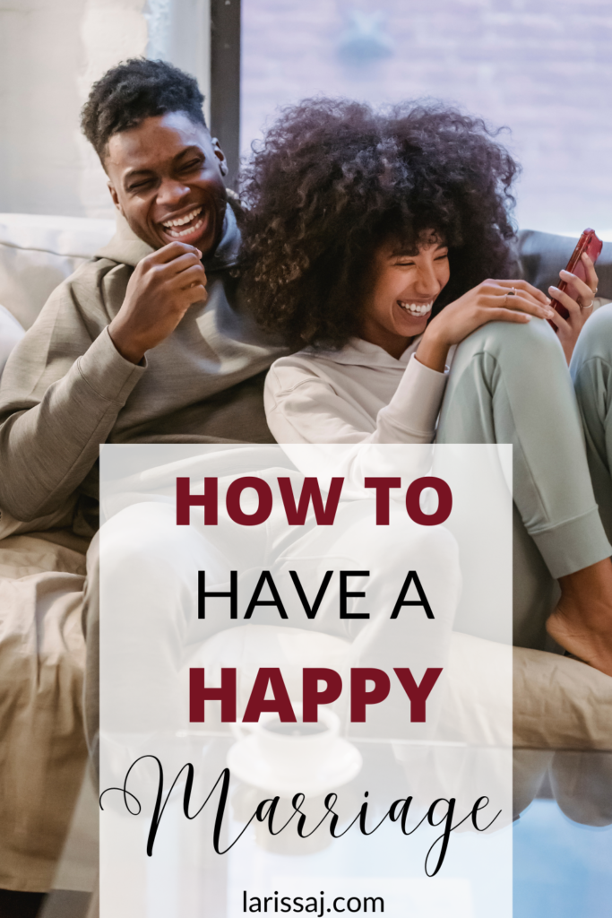 Black couple sitting on the couch laughing together. How to have a happy marriage.